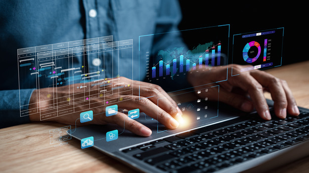 Analyst working with computer in Business Analytics and Data Management System to make report with KPI and metrics connected to database. Corporate strategy for finance, operations, sales, marketing. stock photo
