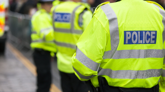 Police in hi-visibility jackets policing crowd control